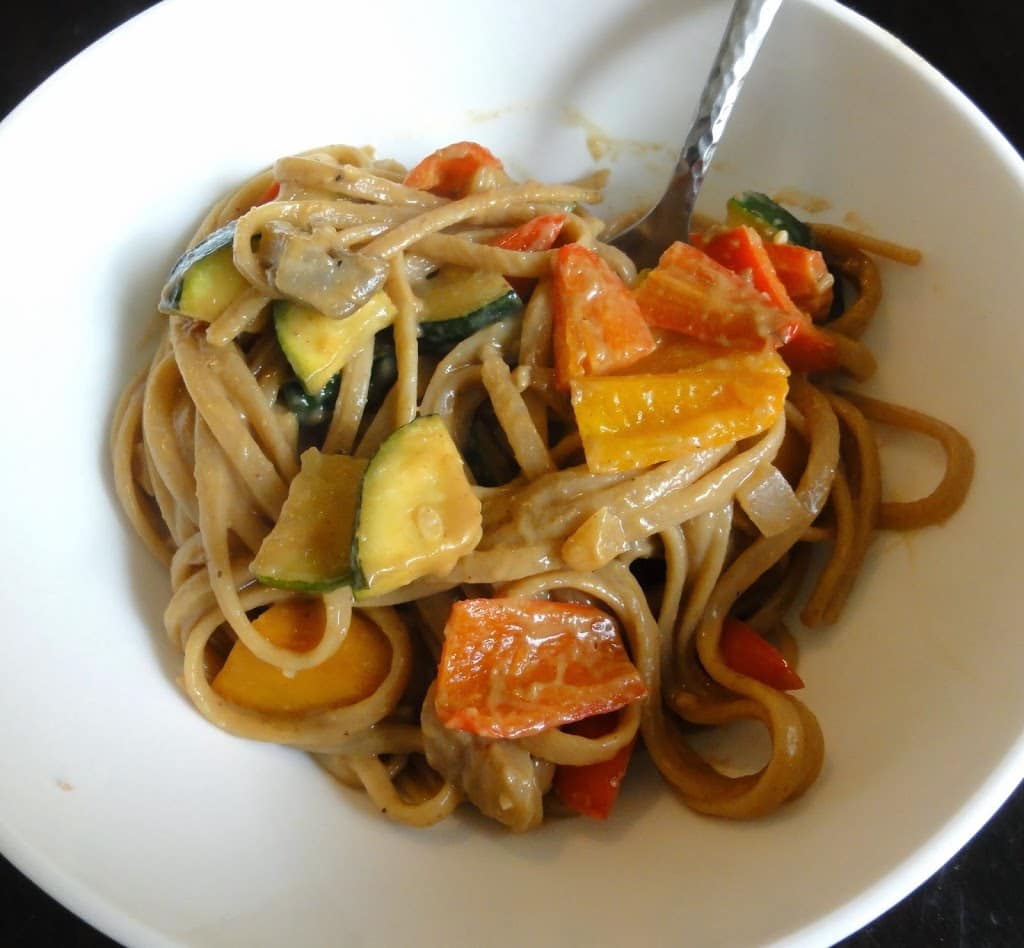 Indonesian Peanut Sauce mixed with veggies in a bowl