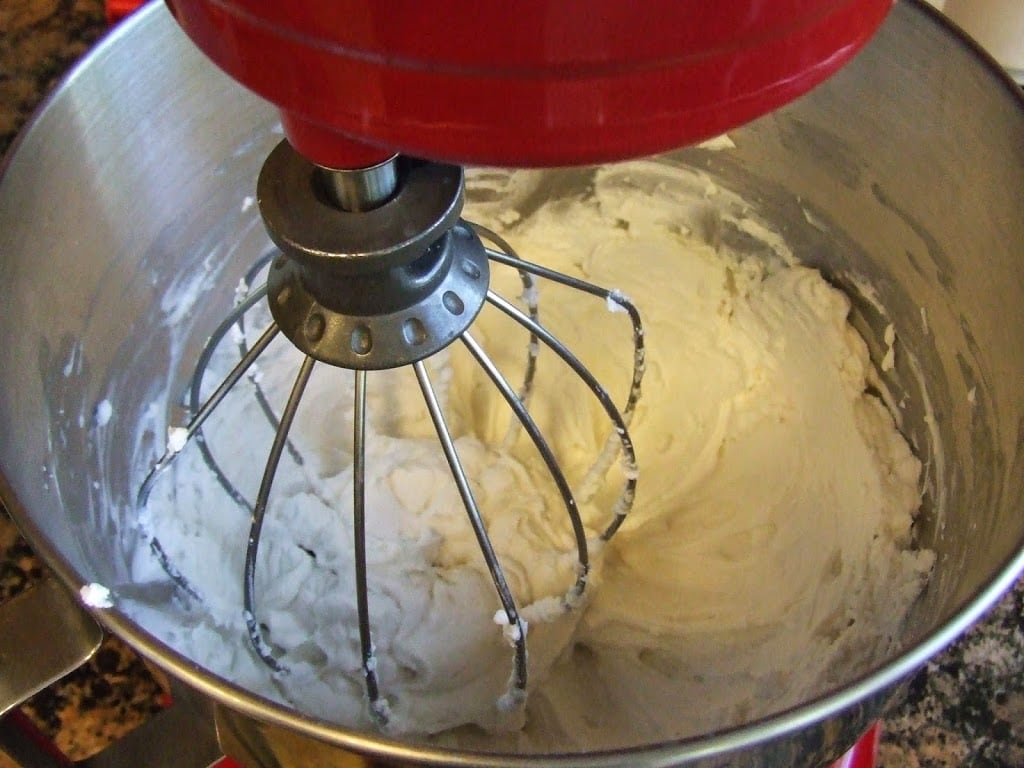 full fat coconut milk being whisked into coconut milk whipped cream