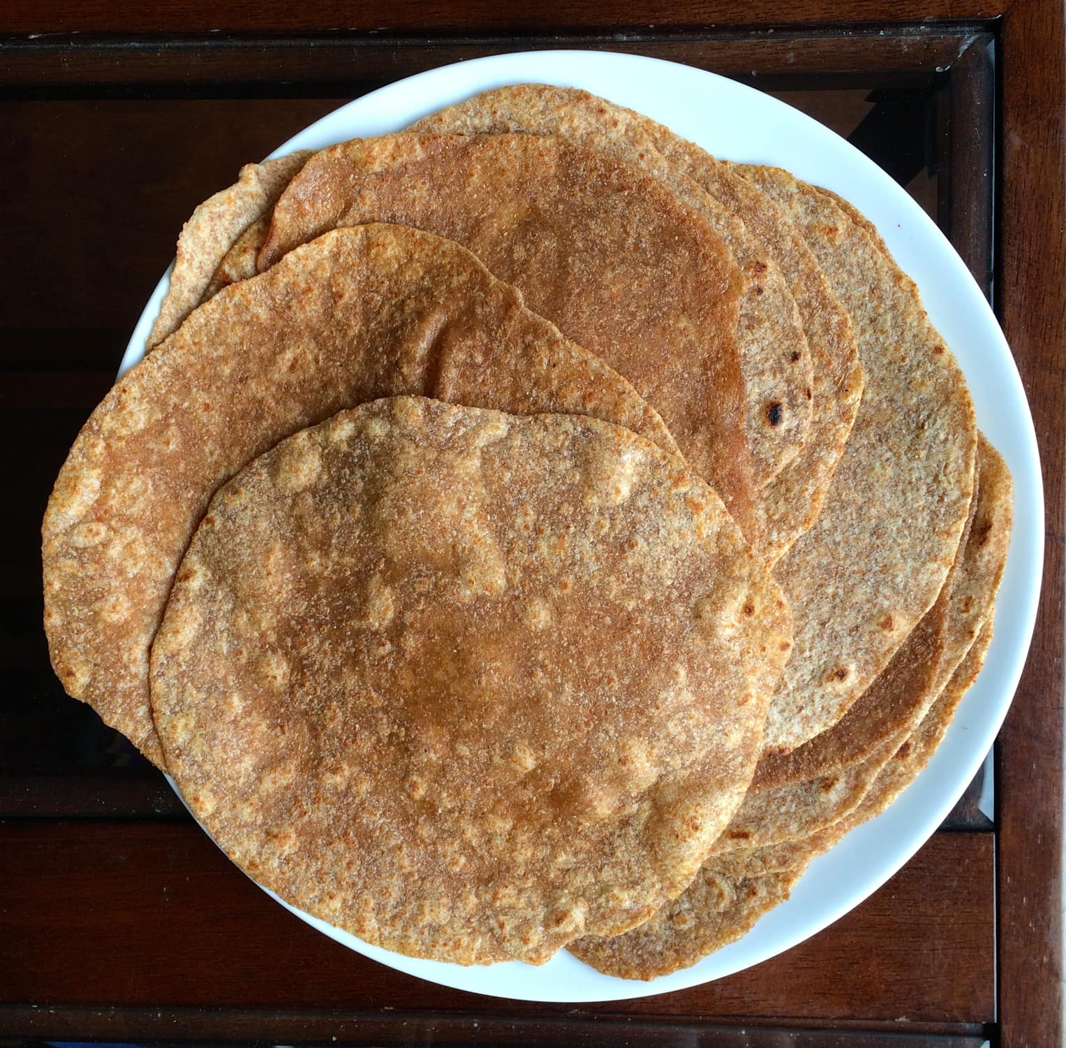 Homemade Whole Wheat Tortillas displayed on a plate