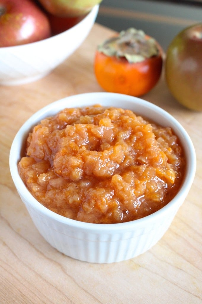 beautiful orange crockpot persimmon applesauce in a bowl