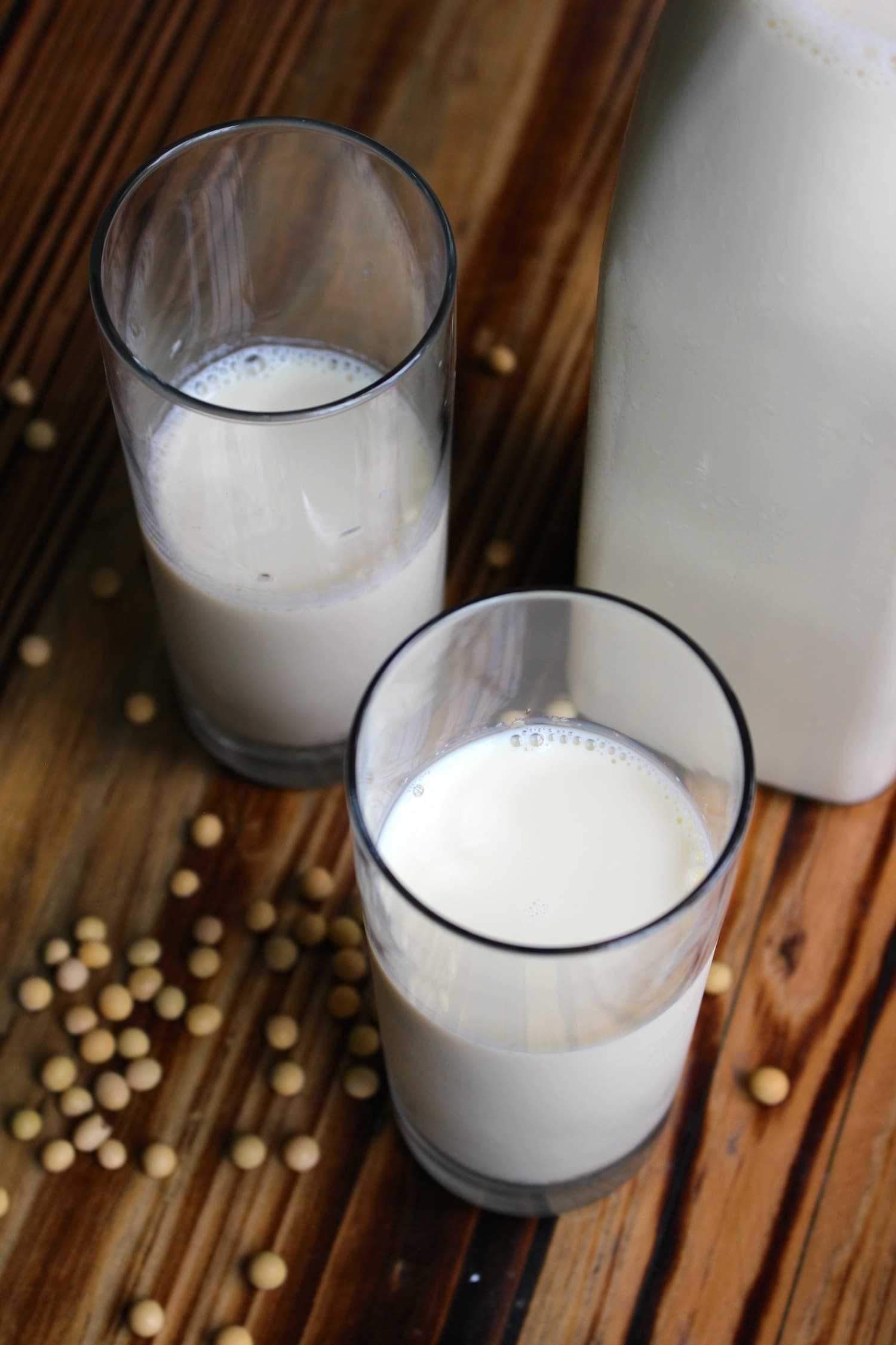 a photo of two glasses filled with homemade soy milk