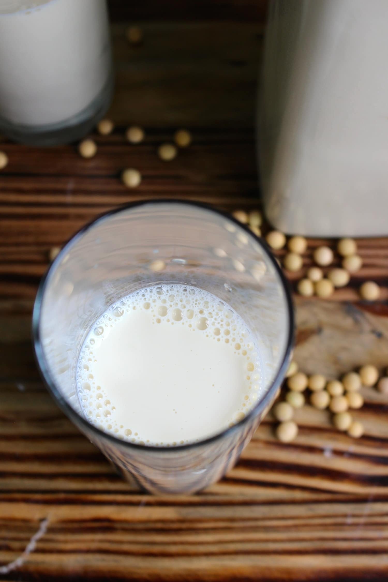 a glass of homemade soy milk top view