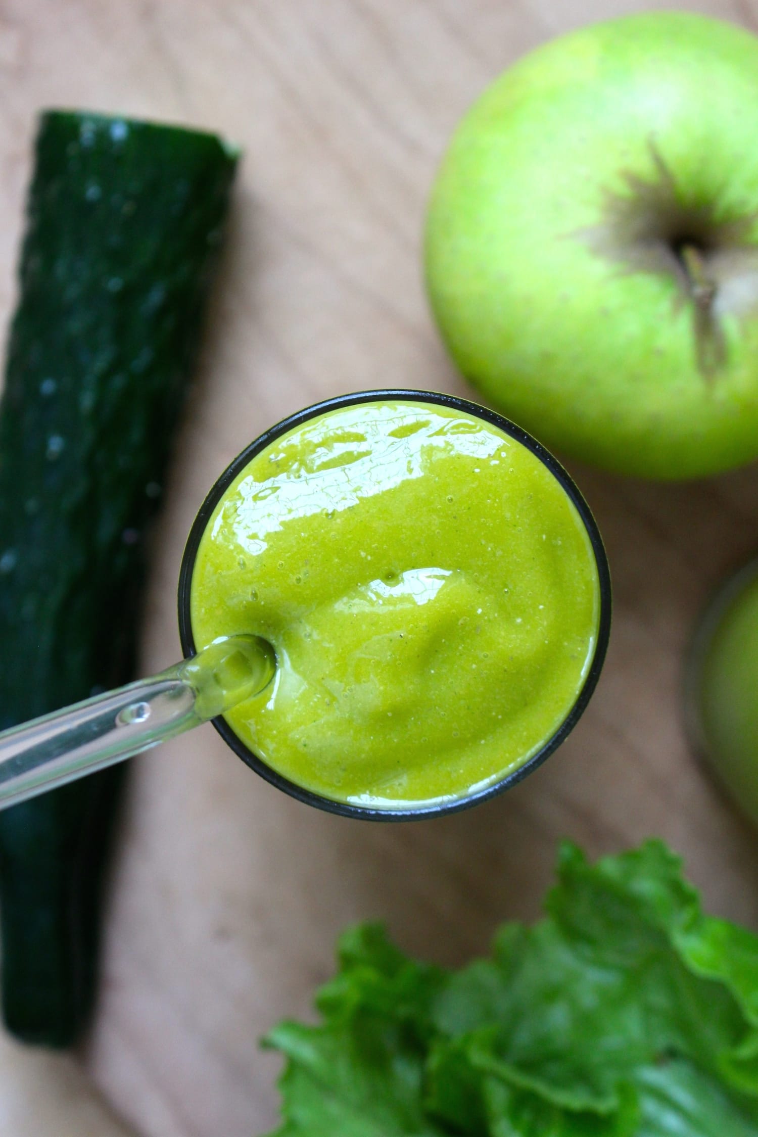 A thick refreshing green smoothie in a glass