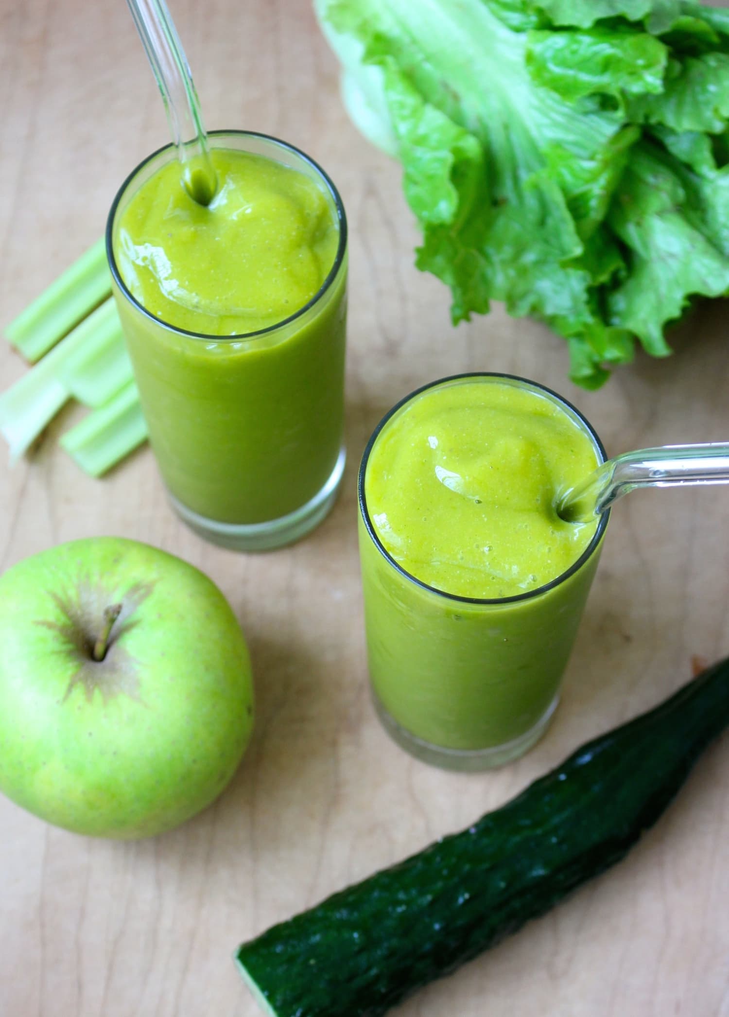 two glasses full of refreshing green smoothie