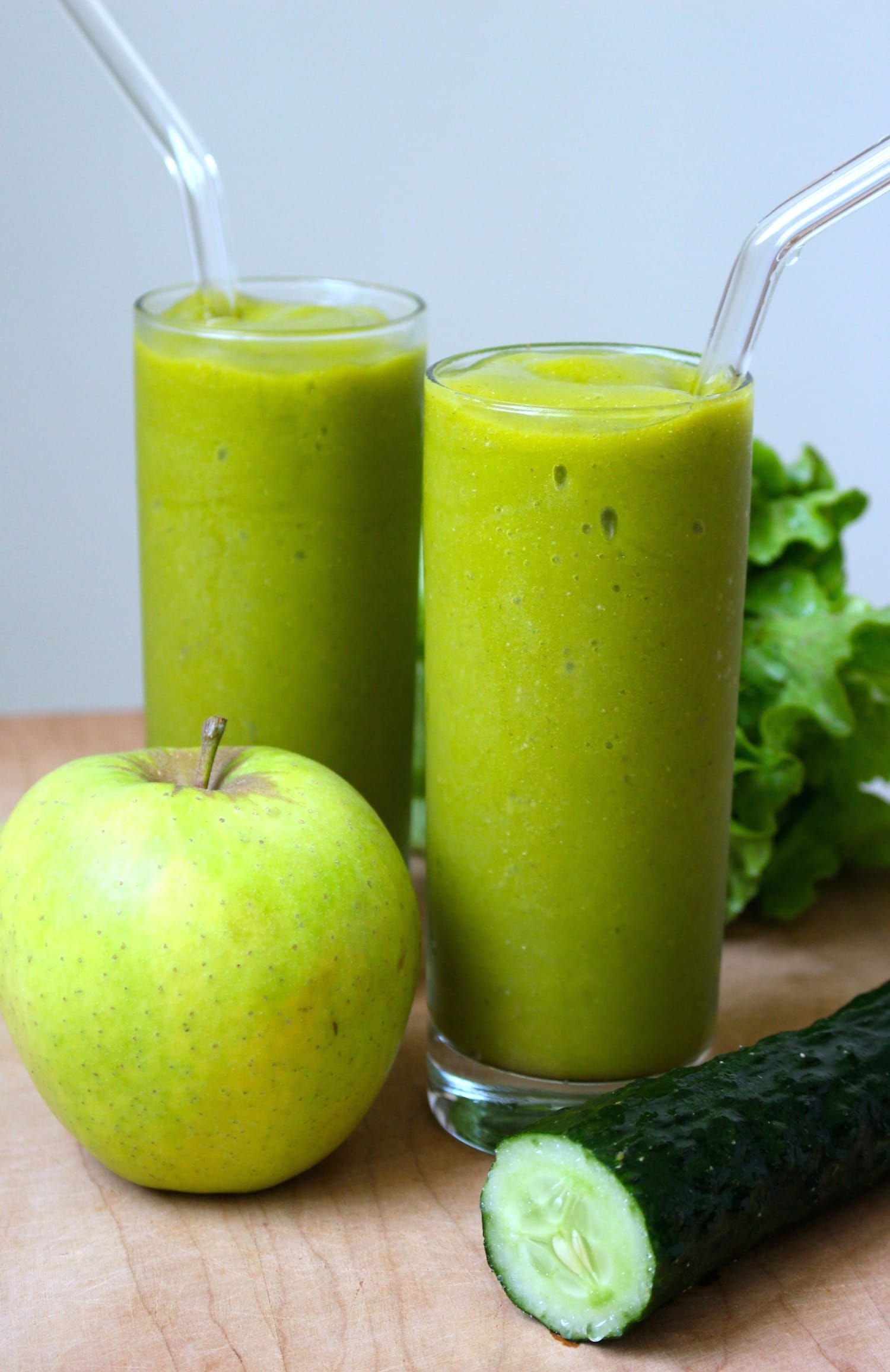 two glasses full of refreshing green smoothie