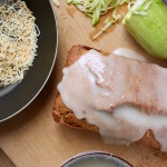 vegan coconut zucchini bread on table with zucchini