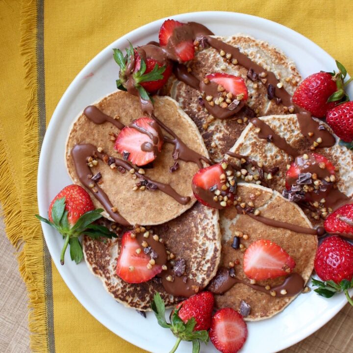 2 Ingredient Oatmeal Banana Blender Pancakes with strawberries on top