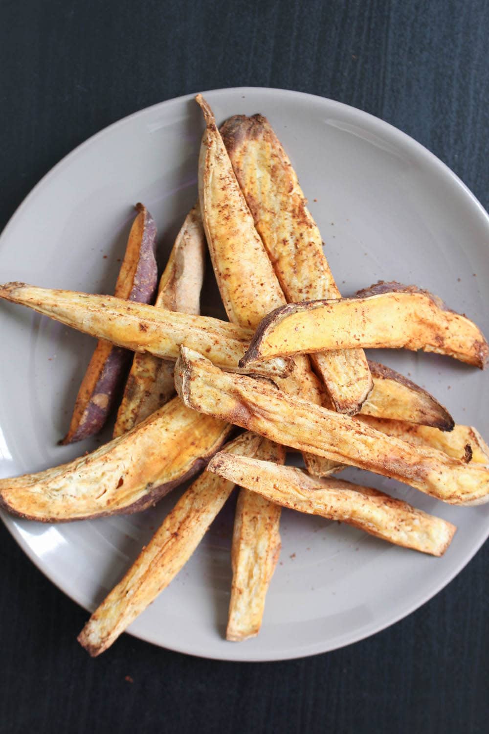 Oil-Free Baked Sweet Potato Fries piled on a plate