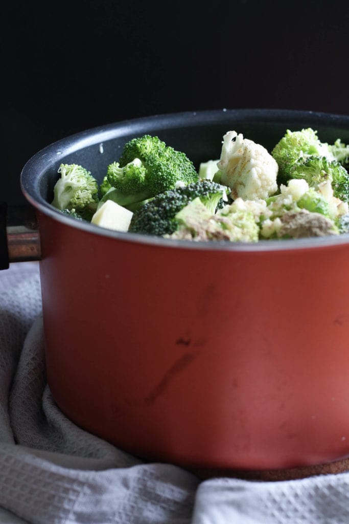 ingredients for broccoli potato soup in a pot