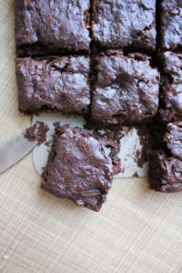 Vegan Zucchini Brownies being cut into squares