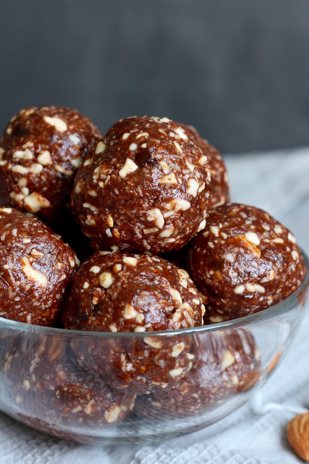 coconut and chocolate energy bites piled high in a bowl