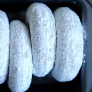 Baked Vegan Powdered Doughnuts lined up