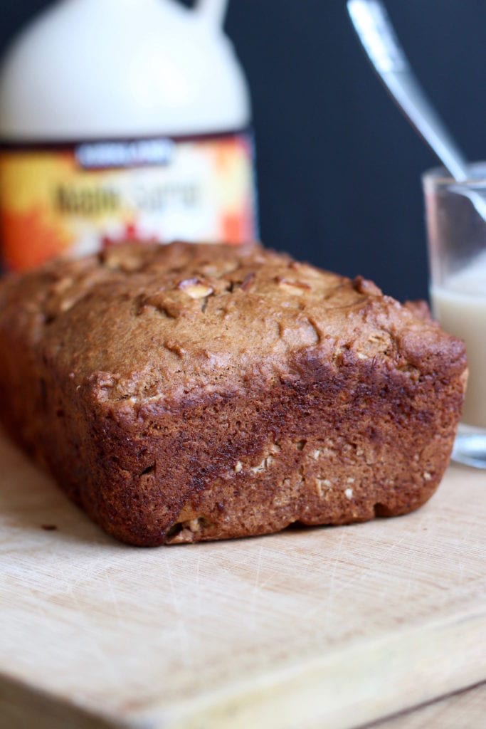 vegan apple cake cooling on a cutting board