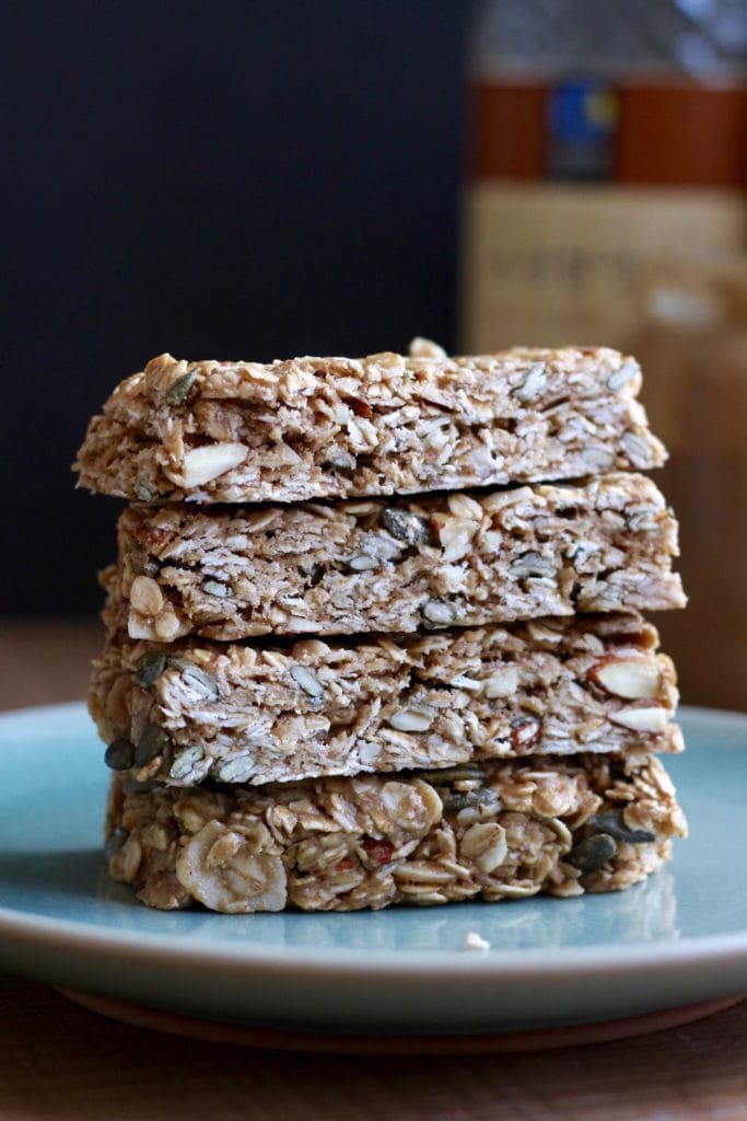 stacked Tahini Oatmeal Granola Bars on a plate