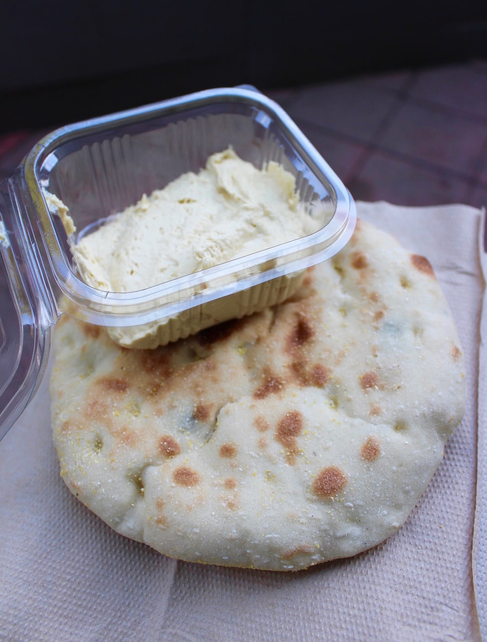 olive bread and hummus in a container