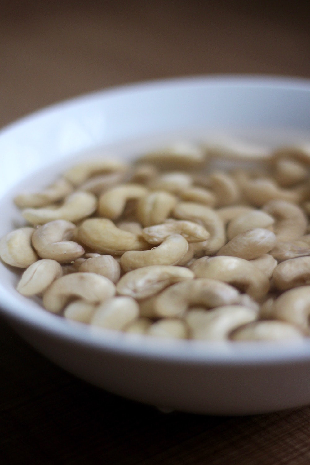 cashews soaked in a bowl of water