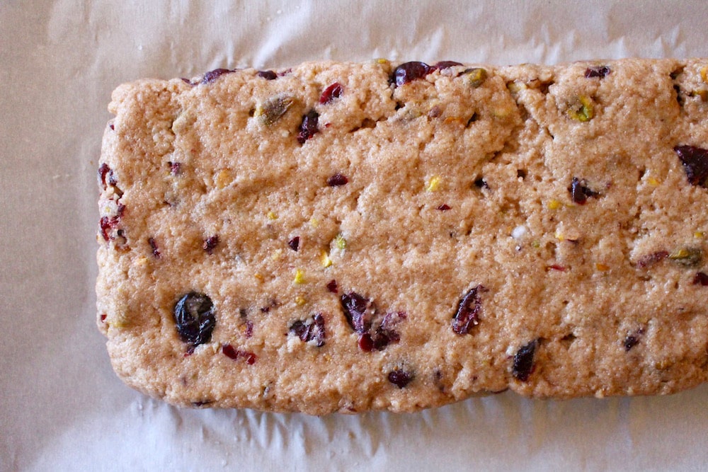 raw Vegan Cranberry Pistachio Biscotti on a baking sheet