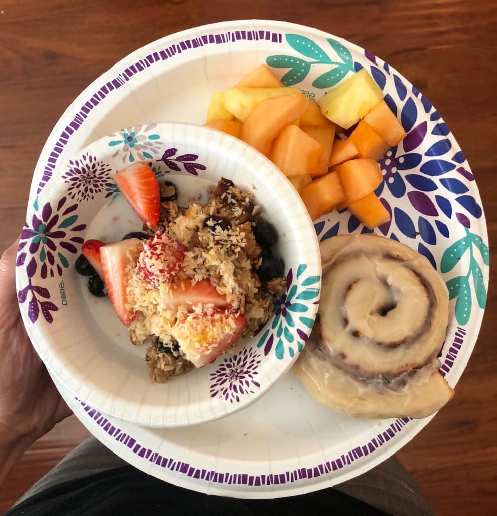 toasted coconut baked oatmeal with berries, fruit and an Annie's cinnamon roll