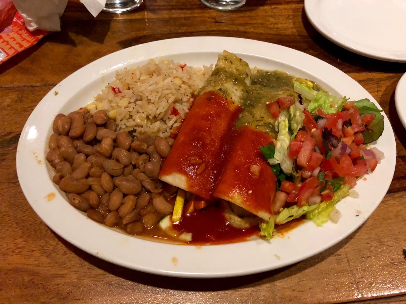 Vegan enchiladas from El Charro Cafe in Tucson, AZ with lots of chip, salsa and guac eaten on the side