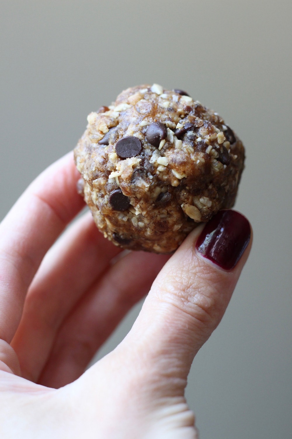 holding Cinnamon Oatmeal Cookie Dough Balls