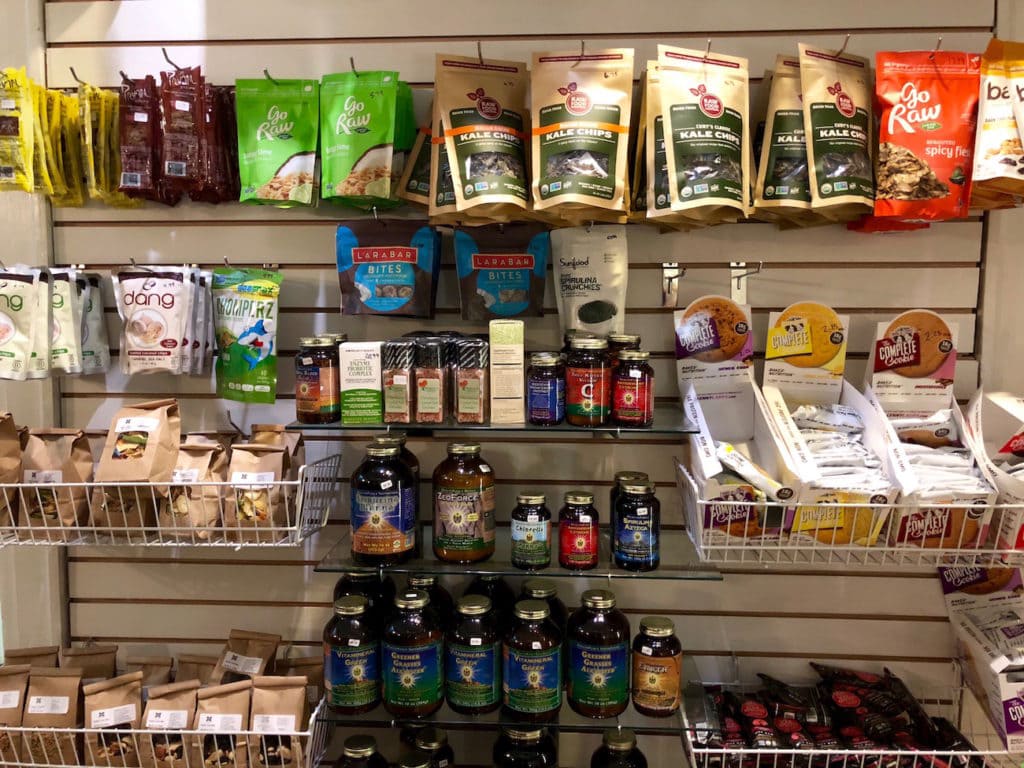 shelf of vegan snacks and products from the mini shop