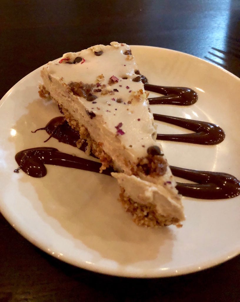 a slice of chocolate chip cookie dough cheese cake