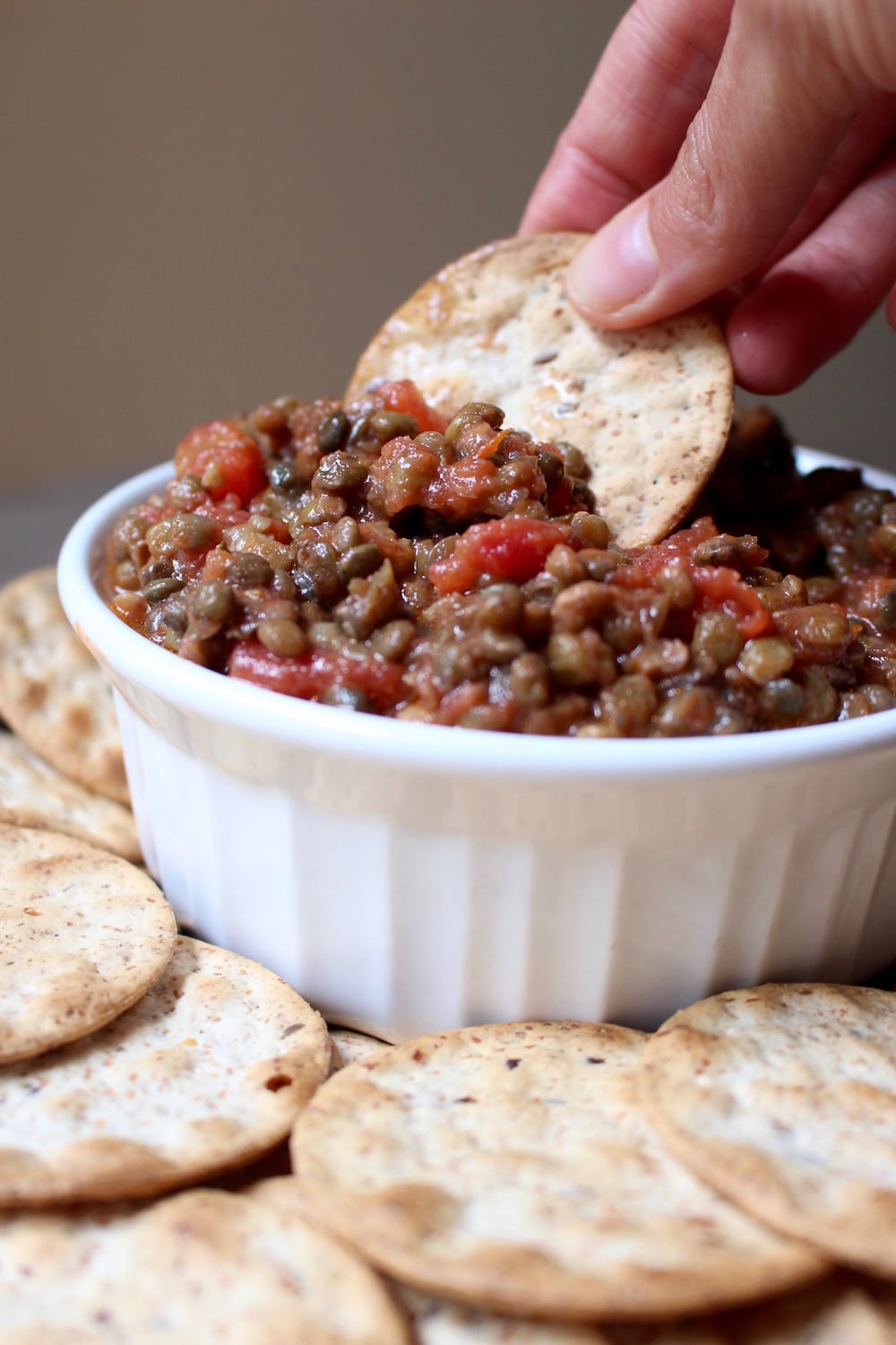 2 Ingredient Trader Joe's Lentil Bruschetta Dip being scooped up with a cracker