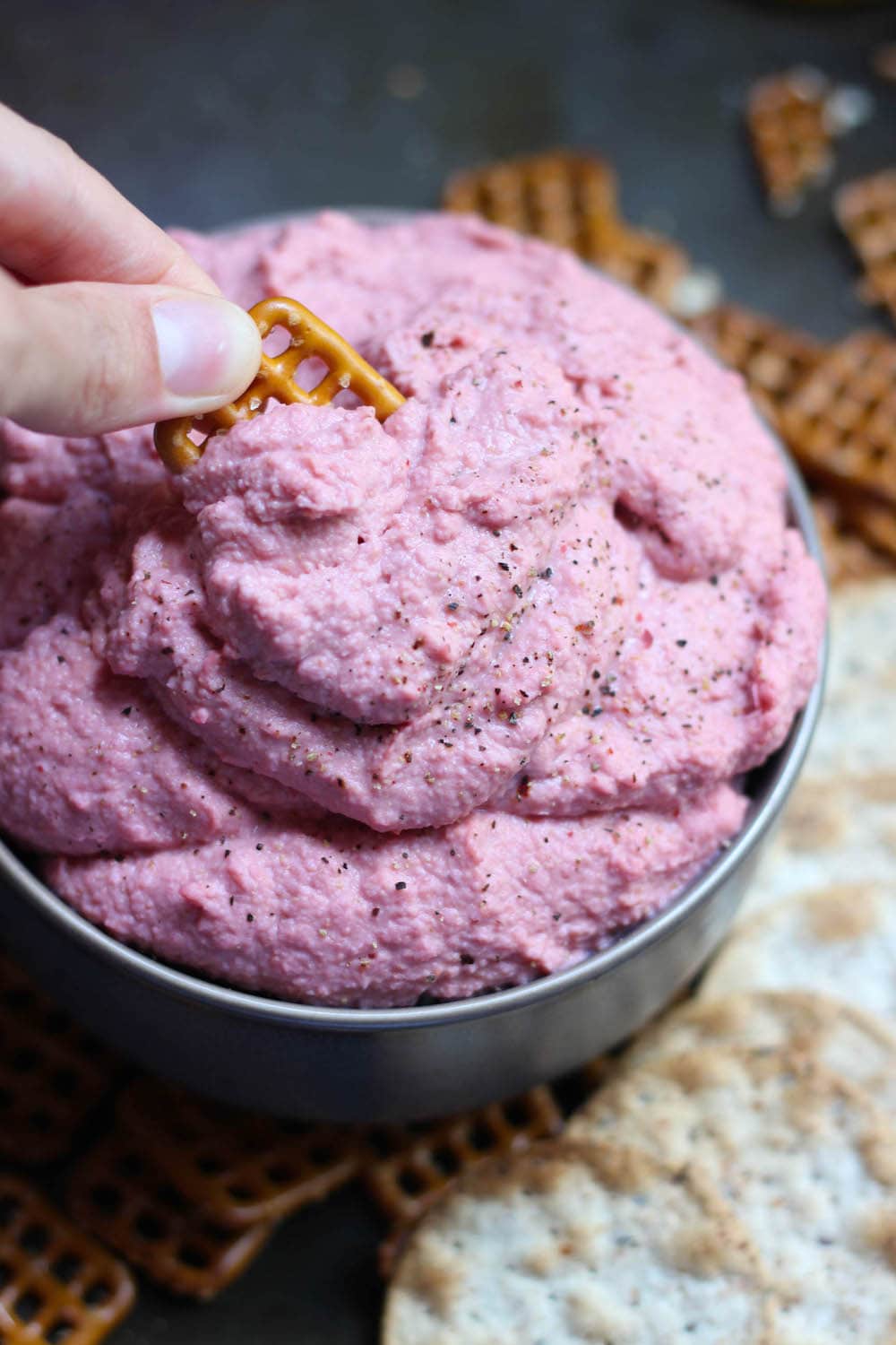 pretzel dipped in Oil Free Beetroot Hummus Recipe