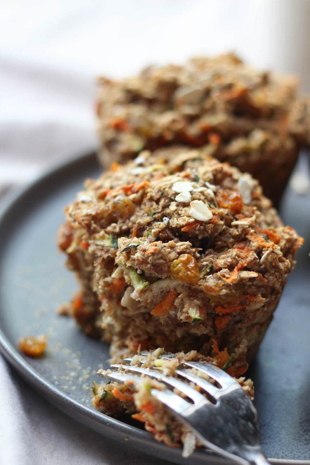 Fork breaking into a Zucchini Carrot Oatmeal Breakfast Muffin