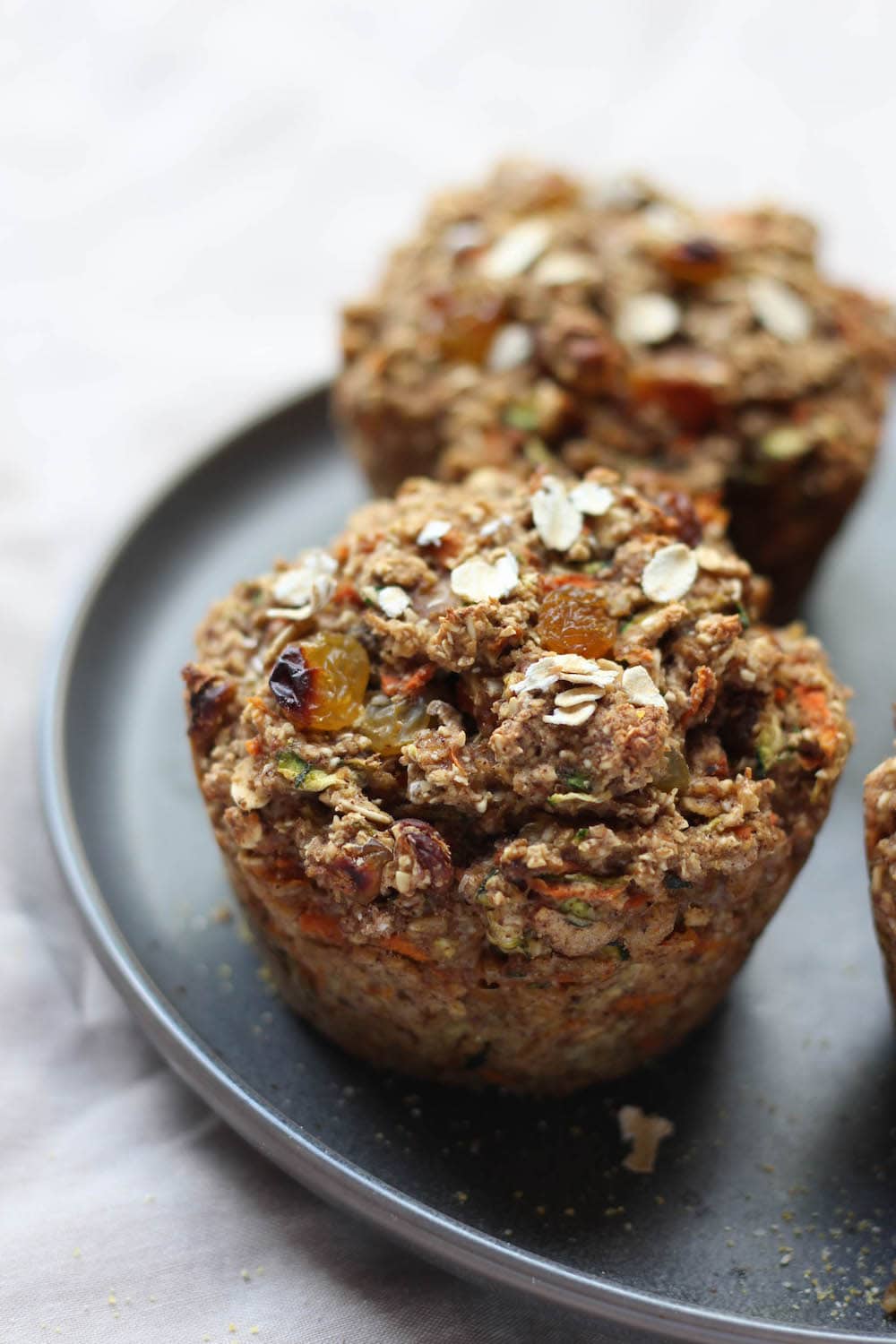 Zucchini Carrot Oatmeal Breakfast Muffins on a plate