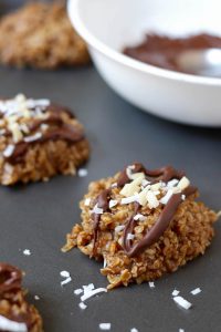 Chocolate drizzled on Almond Butter Coconut No Bake Cookies