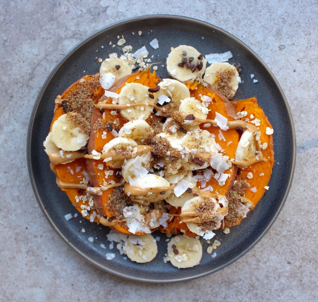 Sweet potato topped with banana, peanut butter and ground flaxseed