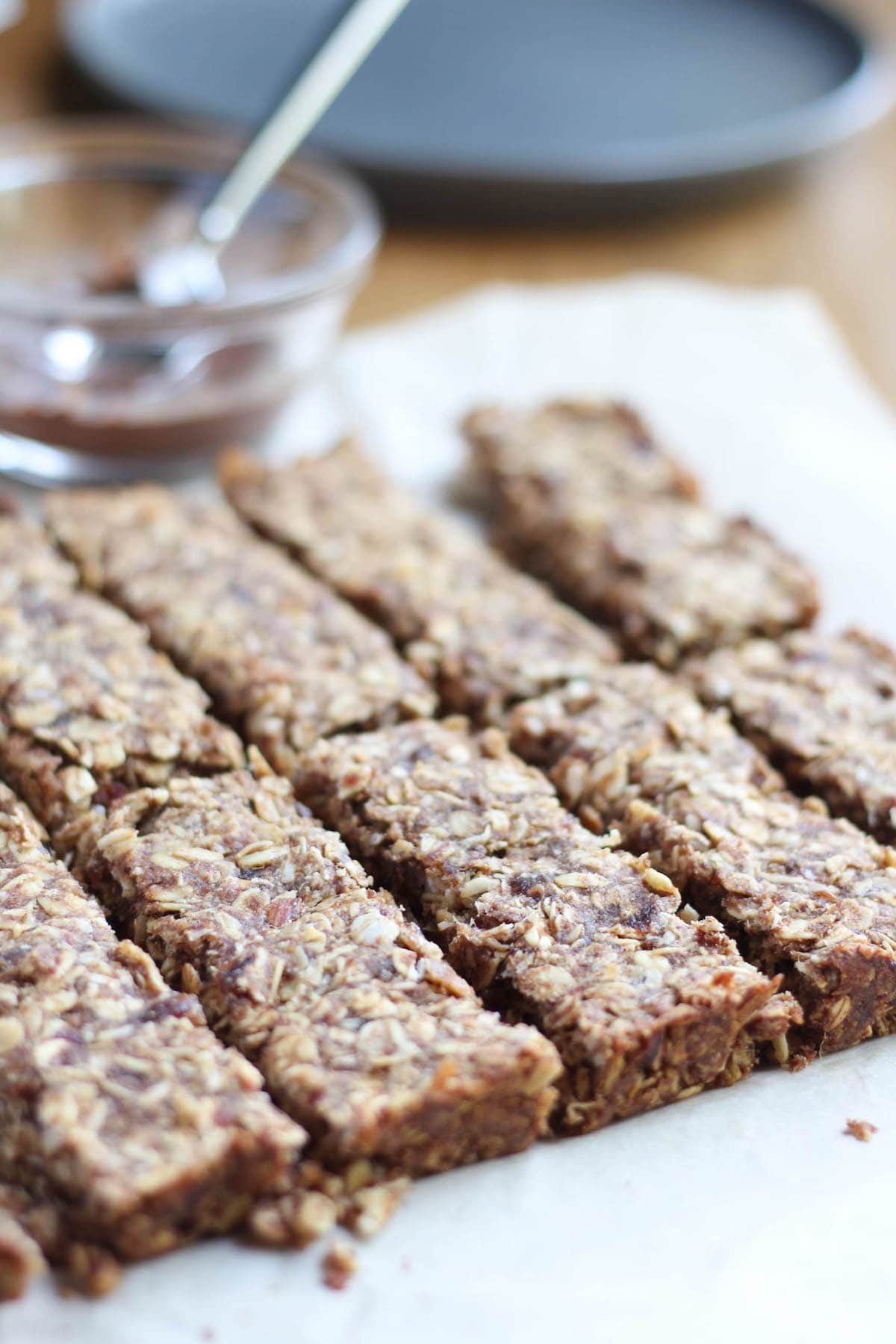 Chewy Almond Butter Date Granola Bars lined up in a row