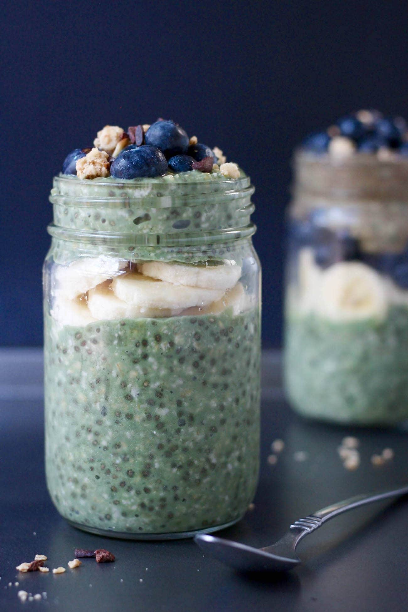 Green Superfood Overnight Oats layered with banana in a mason jar
