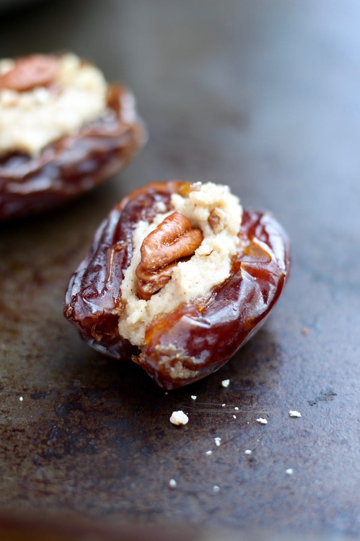 Dates stuffed with vegan cream cheese and pecans