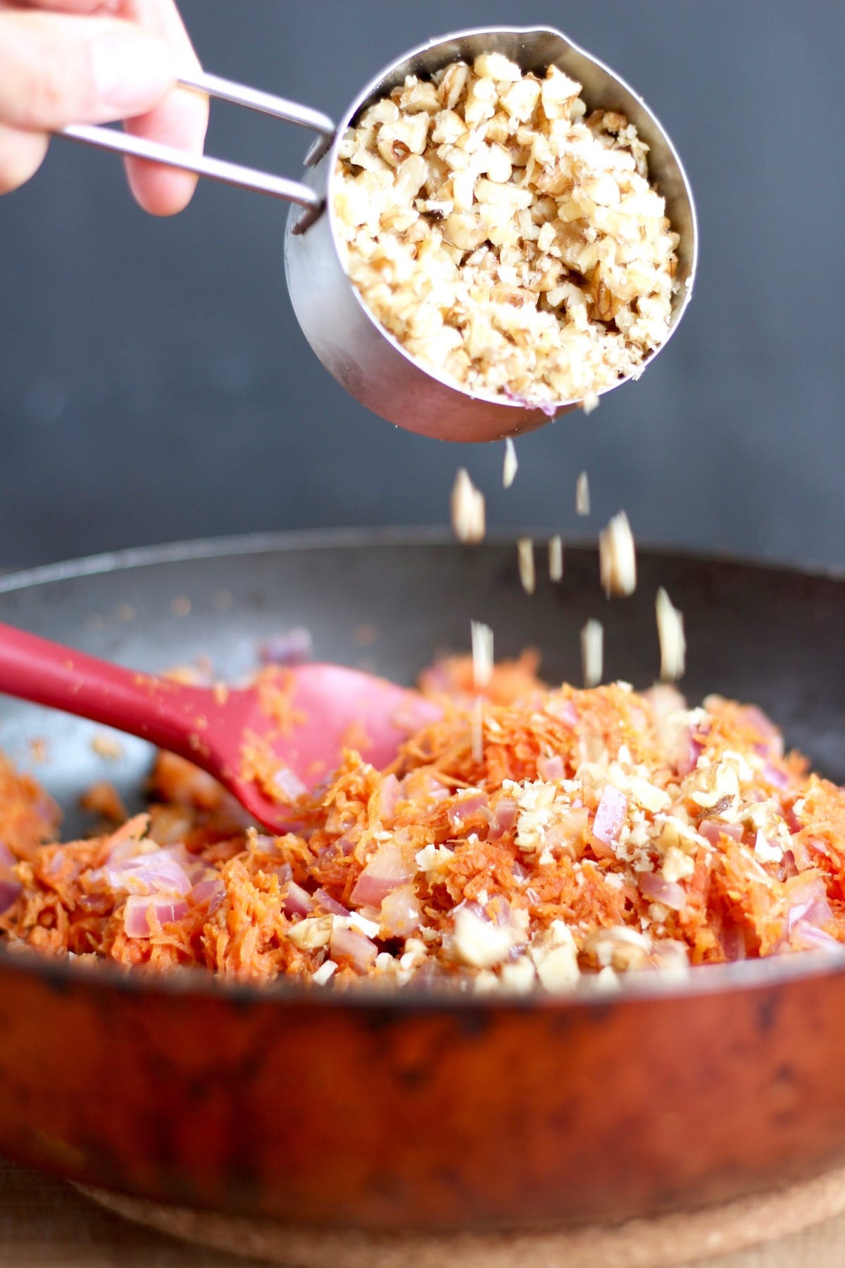 adding chopped walnuts to veggie burger filling