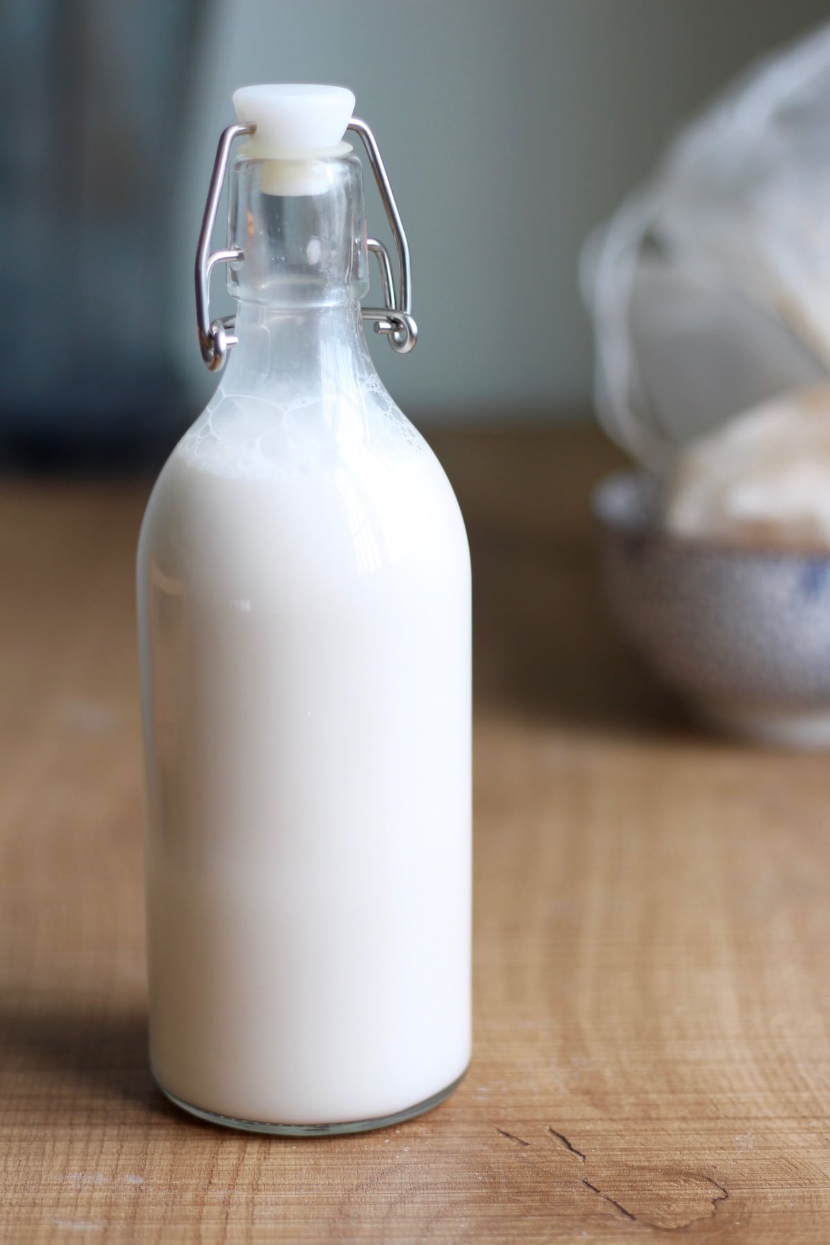 Freshly made almond milk in a glass jar