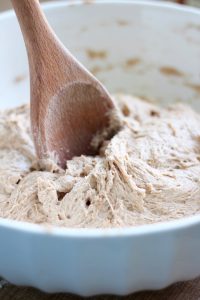 whole wheat sandwich bread down being mixed with a wooden spoon