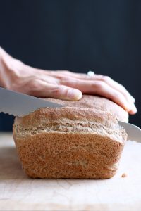 No Knead Whole Wheat Vegan Sandwich Bread being sliced