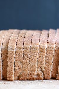 A loaf of whole wheat sandwich bread cut into slices