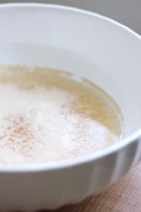 yeast getting frothy in a mixing bowl