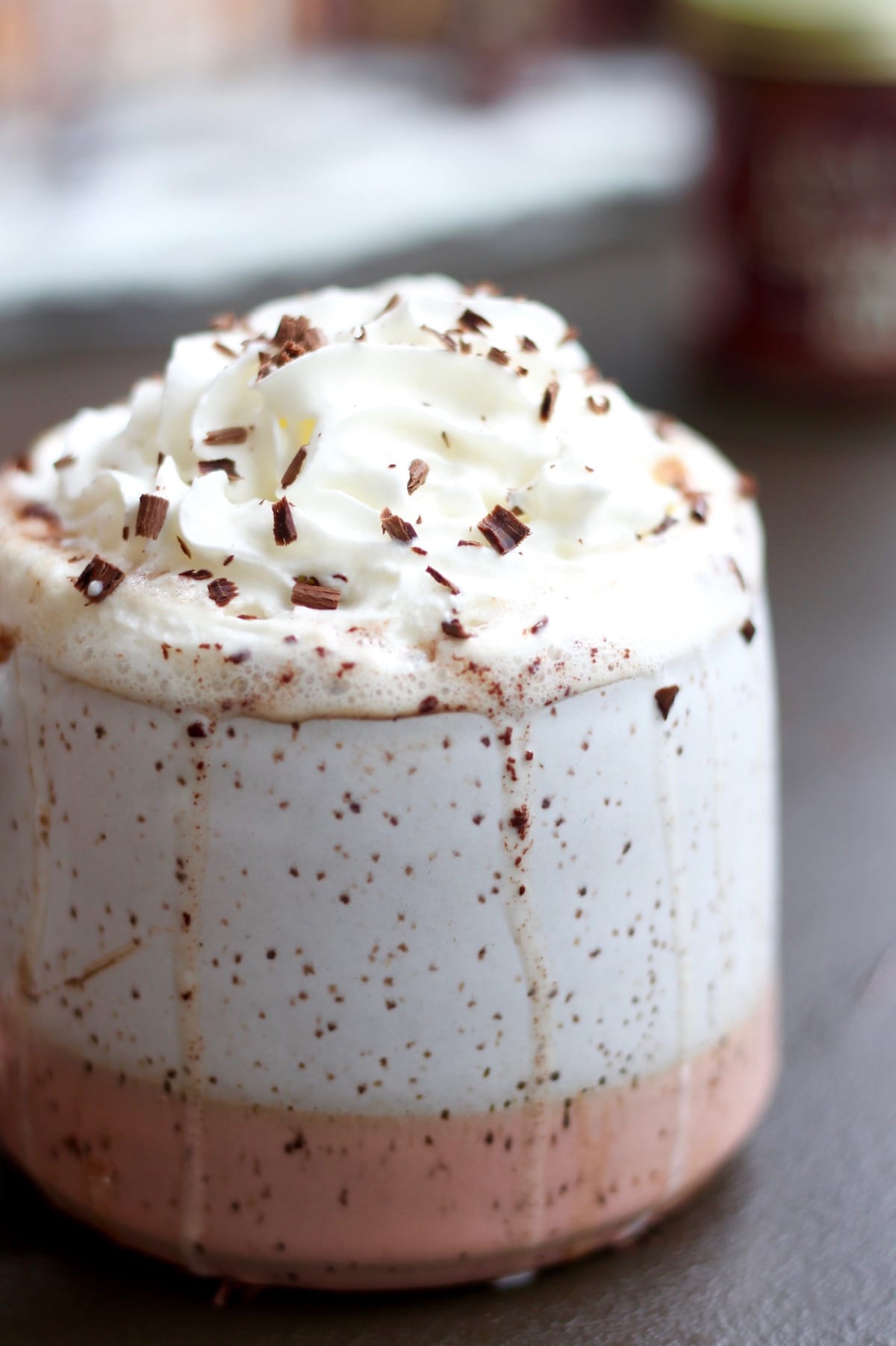 chocolate dripping down a mug of hot chocolate