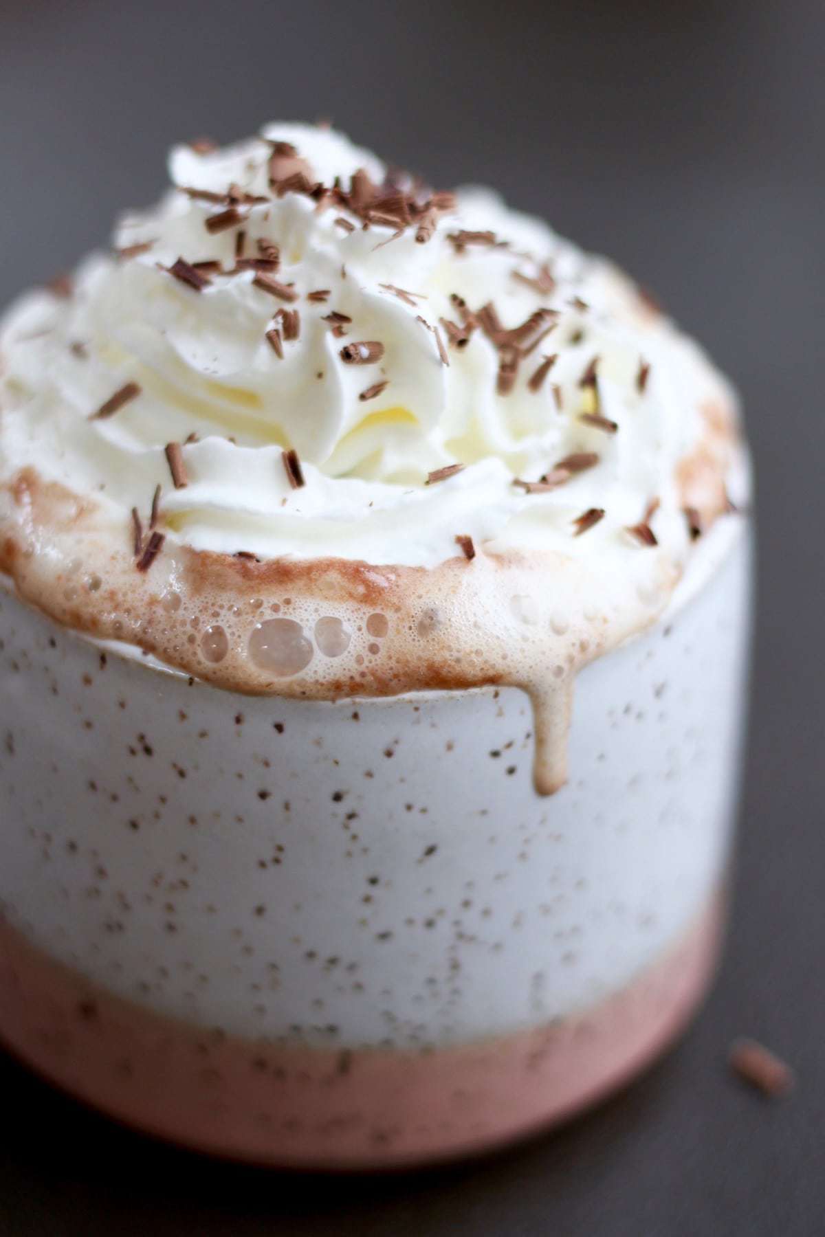 Vegan Nutella Hot chocolate topped with whipped cream and chocolate shavings