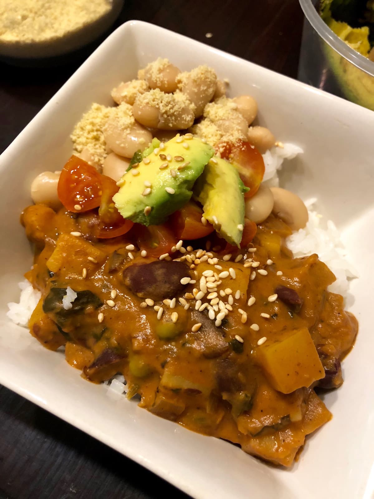 African peanut stew with rice, avocado, beans and nooch