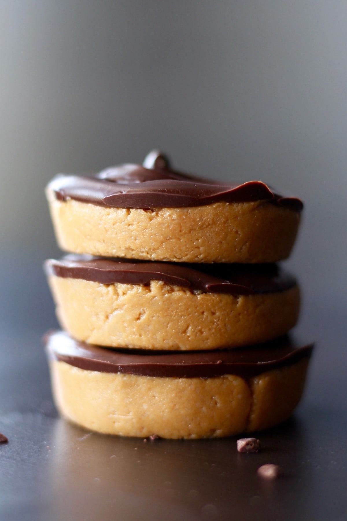 gooey peanut butter chocolate coated cups stacked on each other