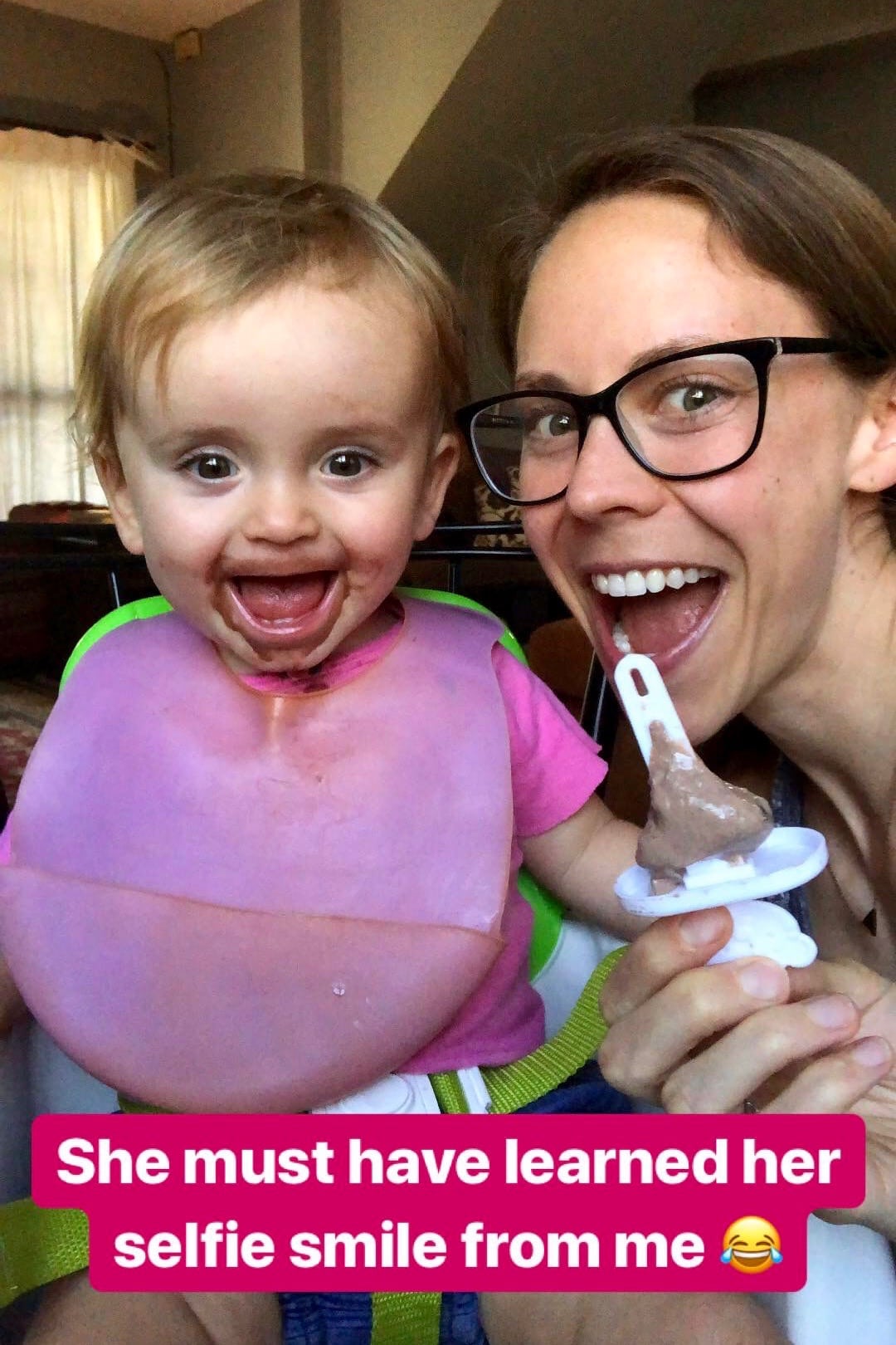 vegan mom and baby enjoying a chocolate popsicle