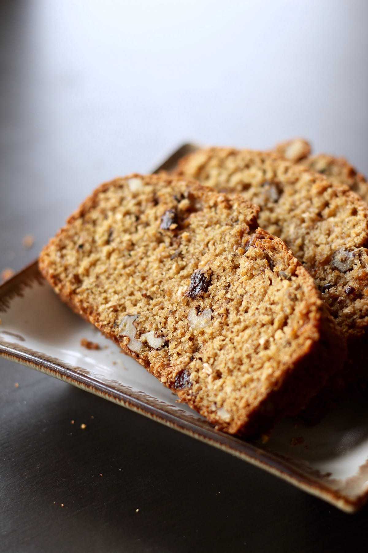 raisin and walnut studded bread on a plate