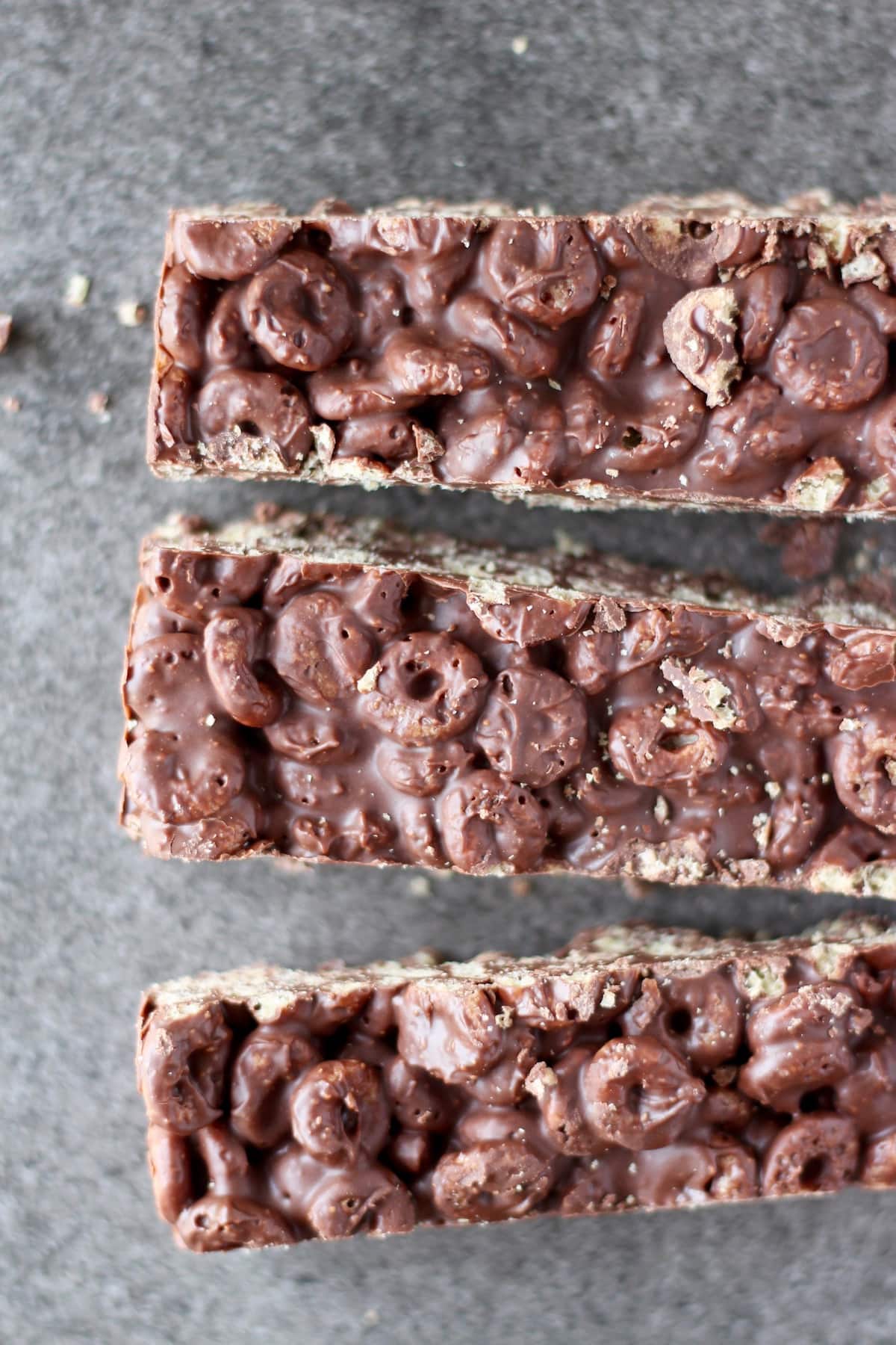 a slab of cereal crunch bars being cut into strips