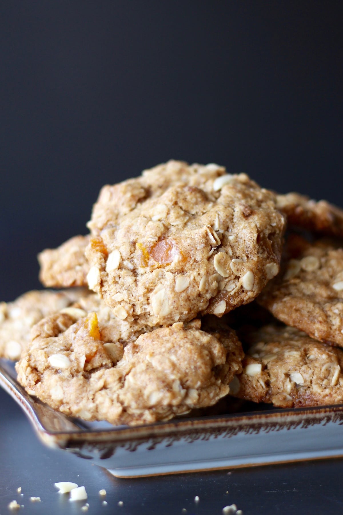 Chewy oatmeal apricot cookies stacked on a plate