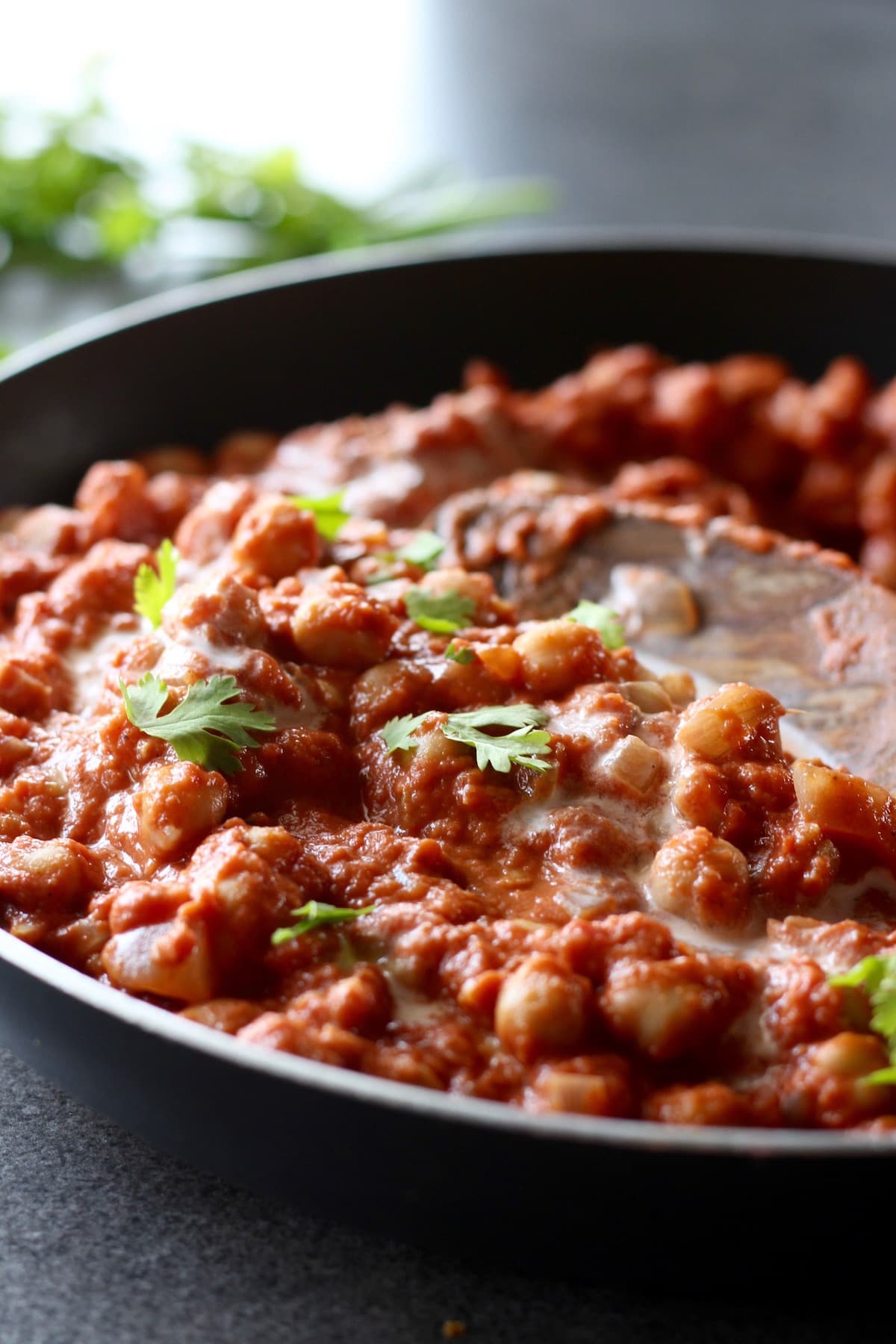 fresh cilantro on top of chickpea tikka masala